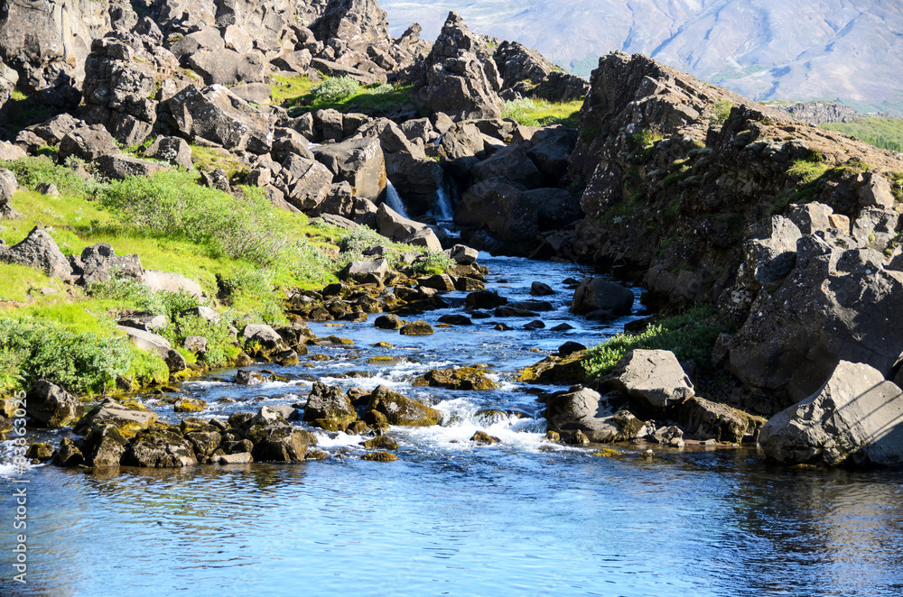 Waterfall of the Oexara River in Pingvellir, Iceland. Waterfall of the Oexara River in Pingvellir, Iceland.
