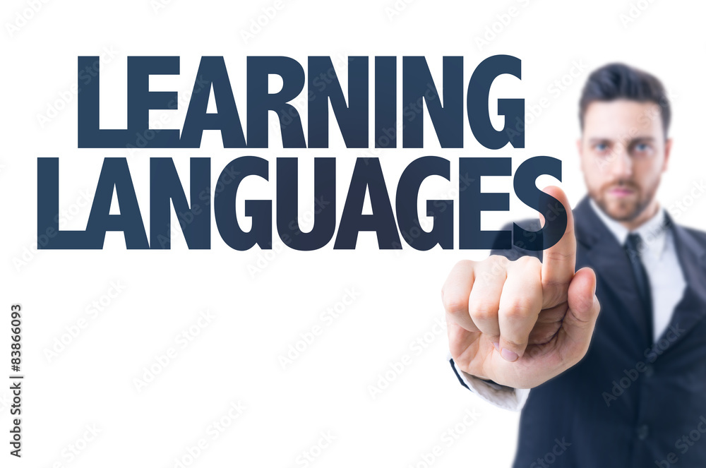 Business man pointing the text: Learning Languages Business man pointing the text: Learning Languages