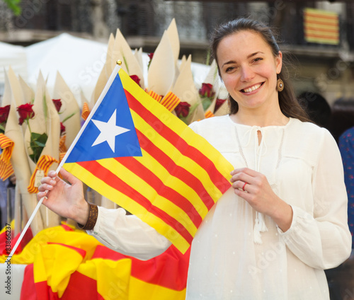 Smiling woman with Catalan Flag  in photo