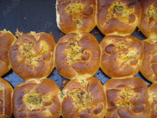 Tray with newly baked traditional cheese pies photo