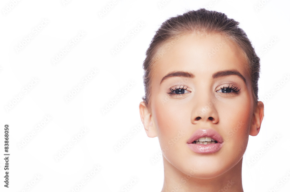 Obraz premium Beautiful young blond woman with ponytail and pink lips