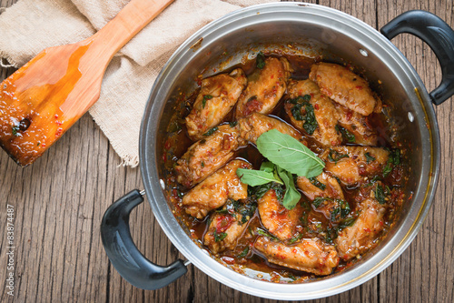 fried chicken with basil leaves photo