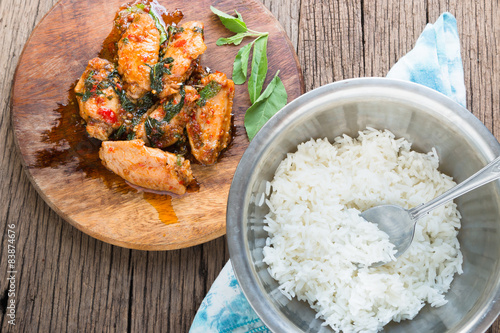 fried chicken with basil leaves photo