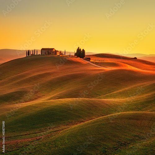Tuscany, sunset rural landscape. Rolling hills, countryside farm photo