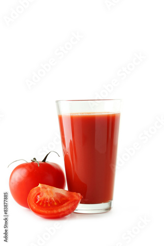 Fresh red tomatoes and tomato juice in glass 