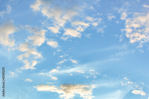 Blue sky with white clouds at sunset