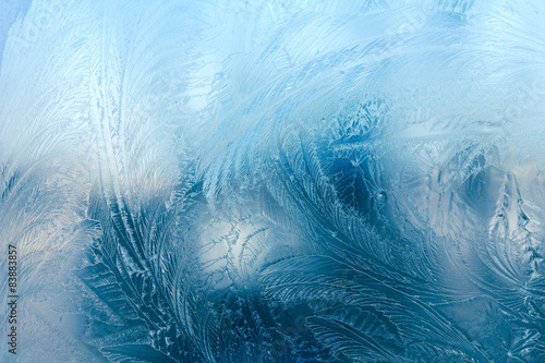 Natural frozen pattern on winter window photo