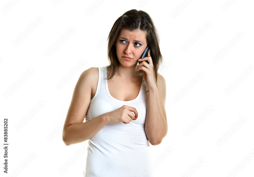 Beautiful young woman with white top talking to the phone Beautiful young woman with white top talking to the phone