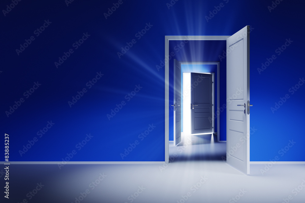 Open white doors with rays of light on blue wall