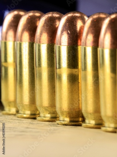 A row of 45 caliber ammunition copper plated bullets