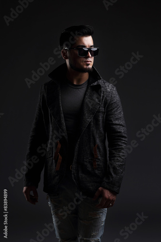 Fashion portrait of handsome stylish man in elegant jacket 