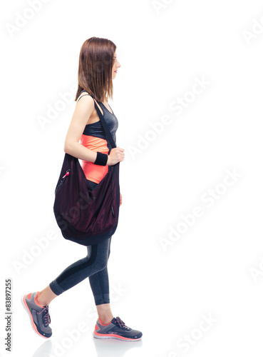 Fitness woman walking with bag