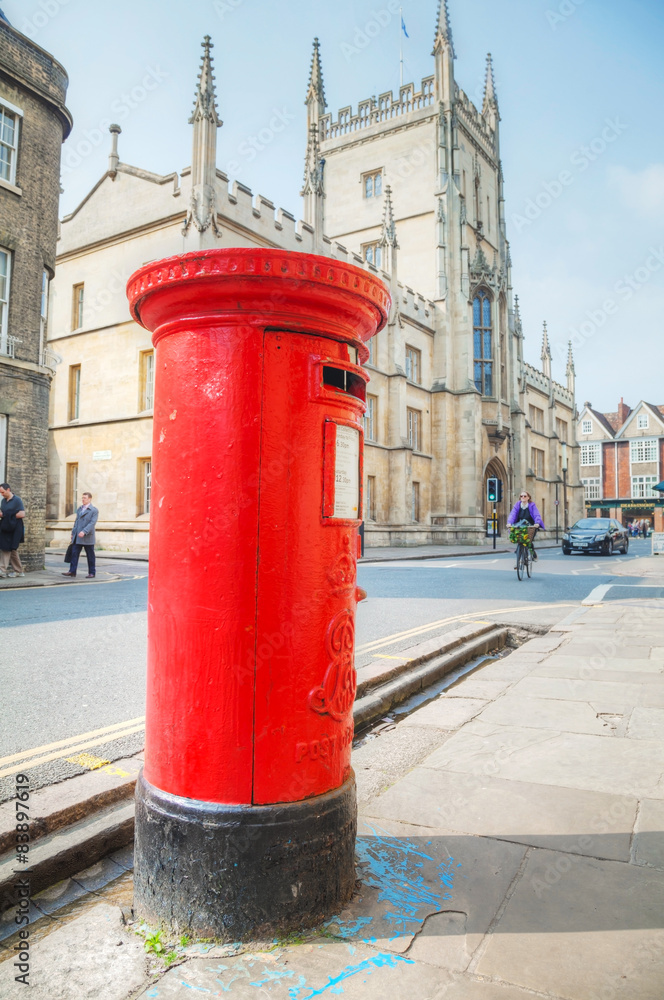Famous red post box on a street in Cambridge, UK