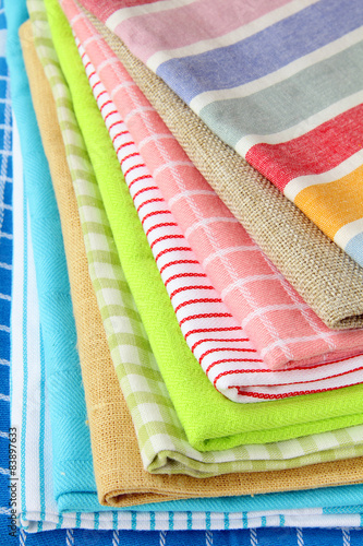 stack of colorful kitchen napkins on white background