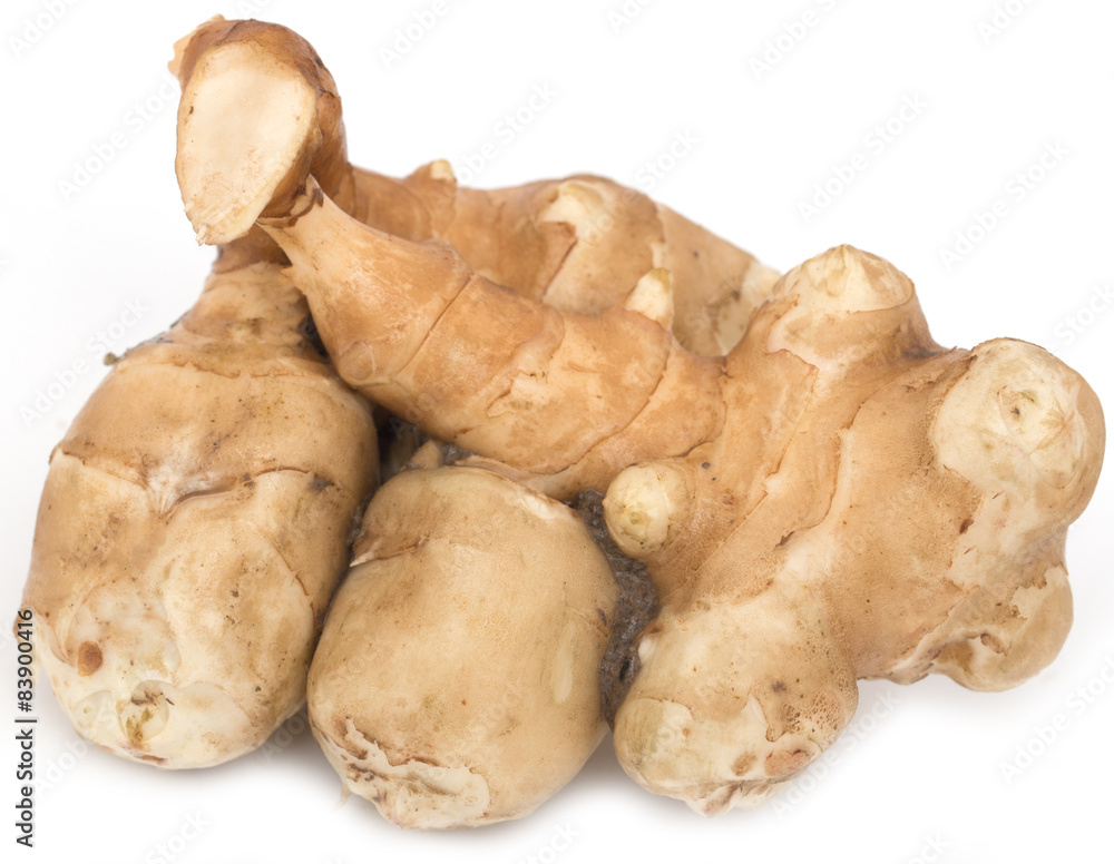 Jerusalem artichoke tubers on a white background Jerusalem artichoke tubers on a white background