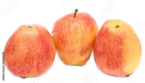 red and yellow apples on a white background