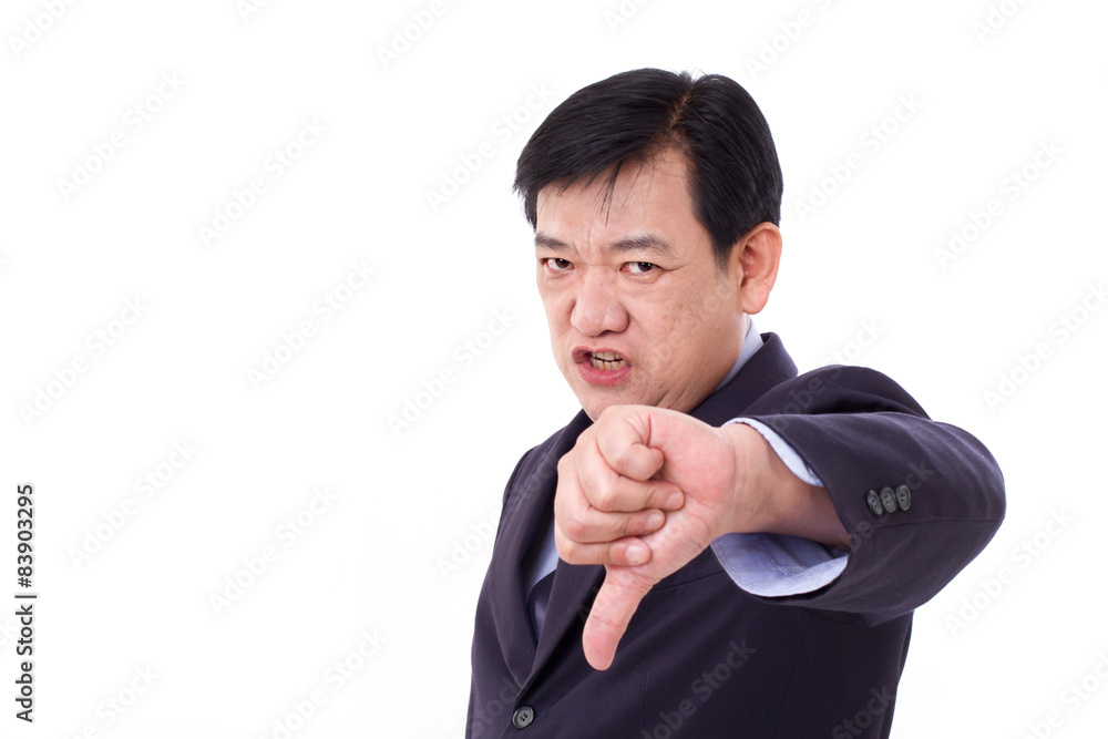 angry, upset, serious businessman giving thumb down angry, upset, serious businessman giving thumb down