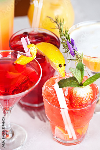 Summer cocktails with pieces of fruit on white background