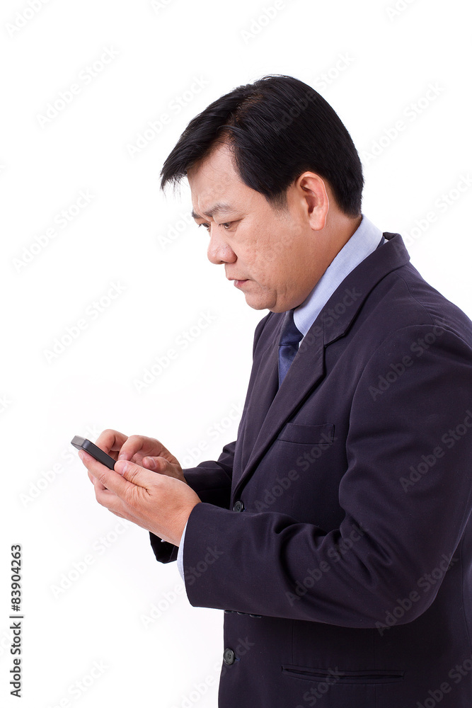 unhappy senior businessman receiving bad news via smartphone app unhappy senior businessman receiving bad news via smartphone app