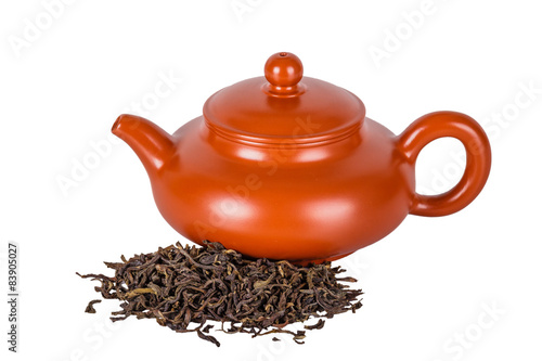 Chinese ceramic teapot and tea leaves on a white background