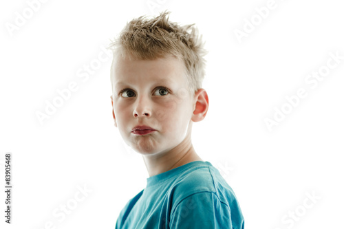 Little boy looking puzzled.