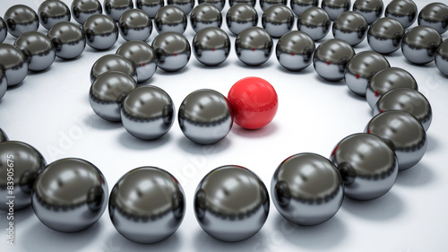Red ball ahead of metal balls in helix
