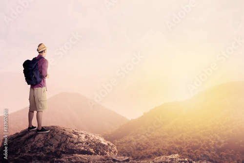 Young Backpacker Enjoying A Valley View