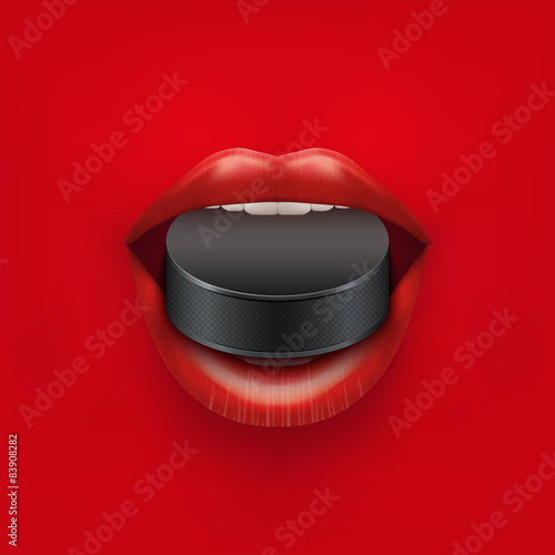 Background of Womans open mouth with ice hockey puck in lips.