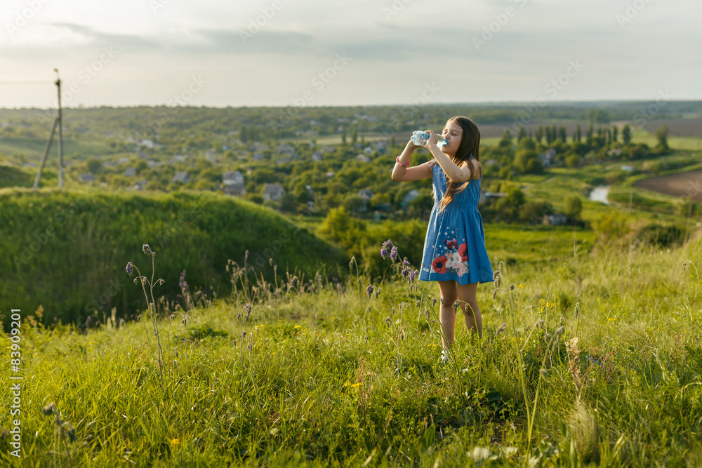 little girl drinks mineral water little girl drinks mineral water
