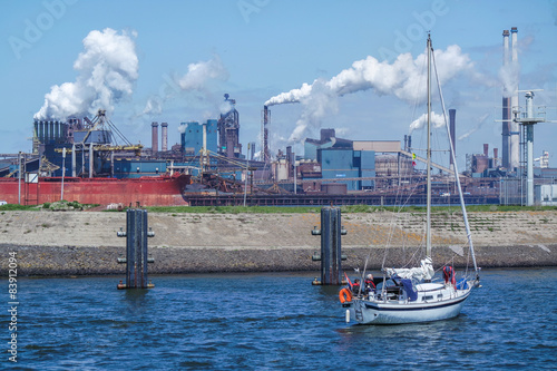 Smelting furnace and extinguish tower with sail boat photo