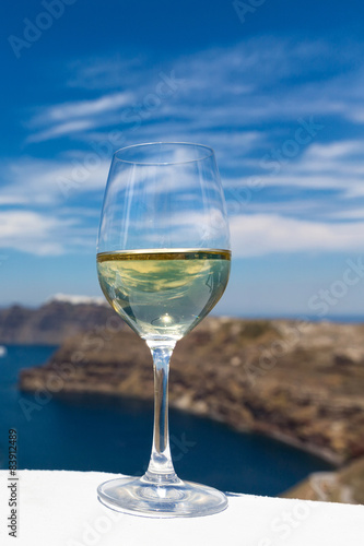 Glass of wine on the background of the sea