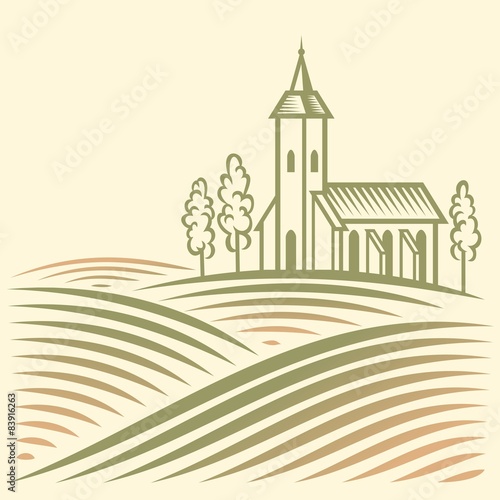 Rural landscape with fields and Catholic temple