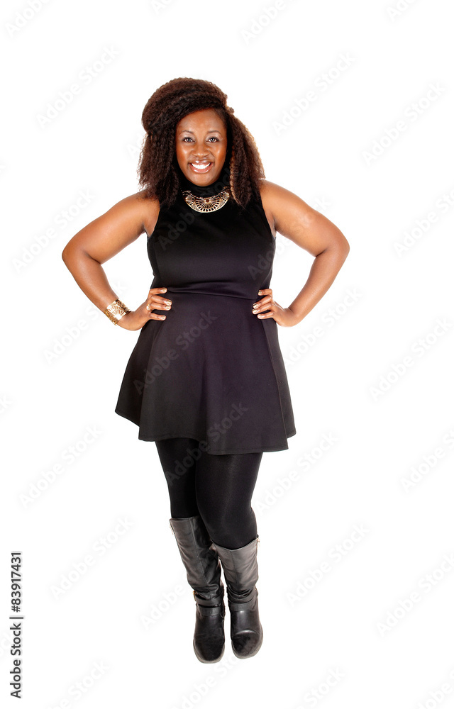 Smiling African woman standing. Smiling African woman standing.