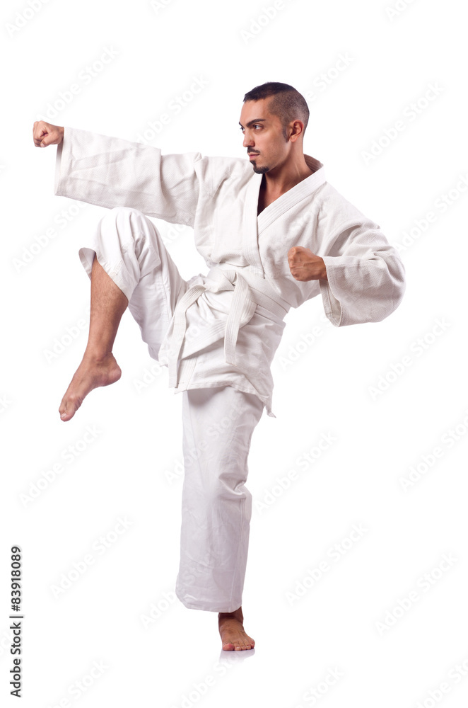 Karate fighter isolated on the white Karate fighter isolated on the white