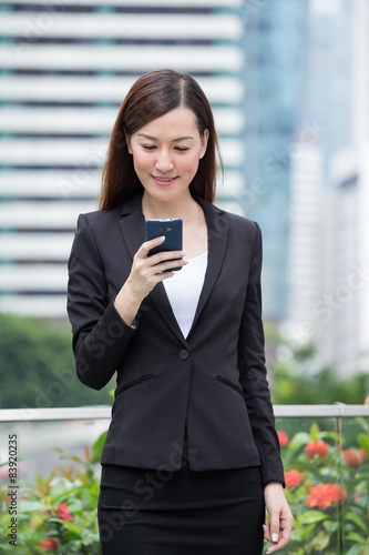 Businesswoman read on cellphone