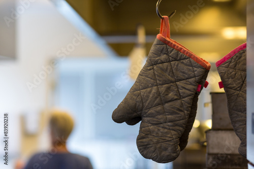 Oven glove hanging in commercial kitchen
