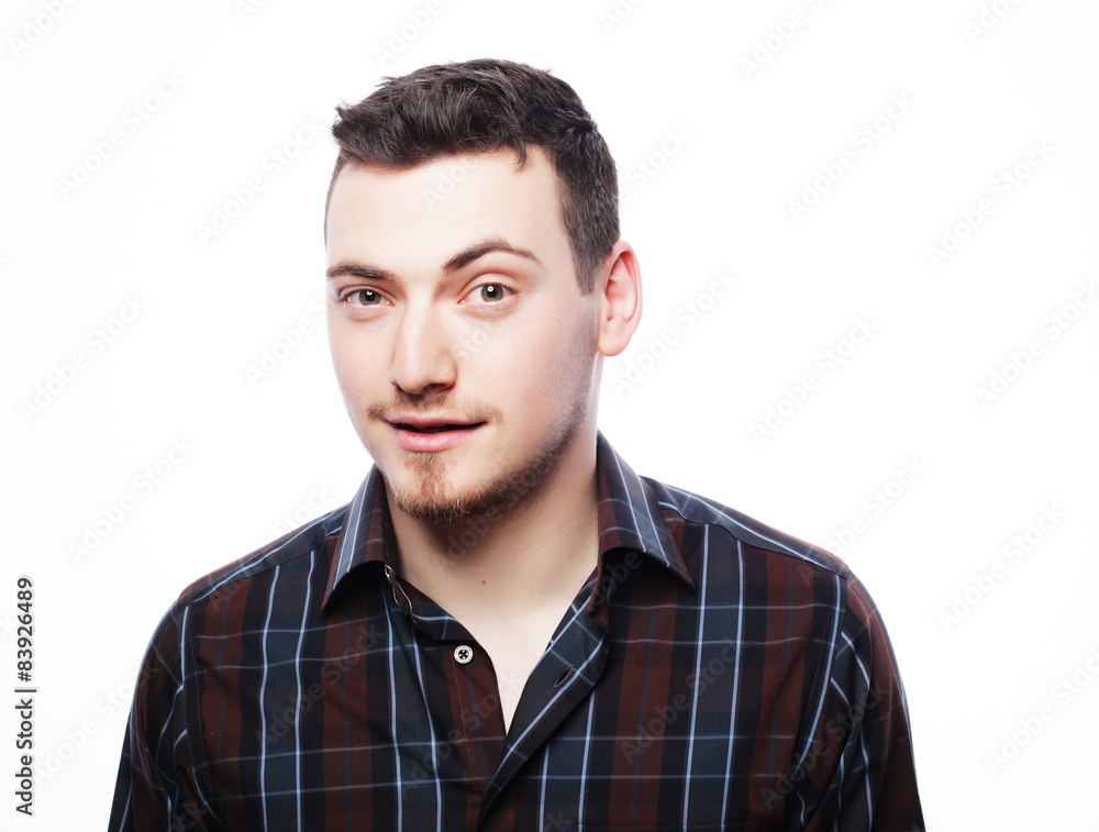 Handsome young man in shirt looking at camera Handsome young man in shirt looking at camera