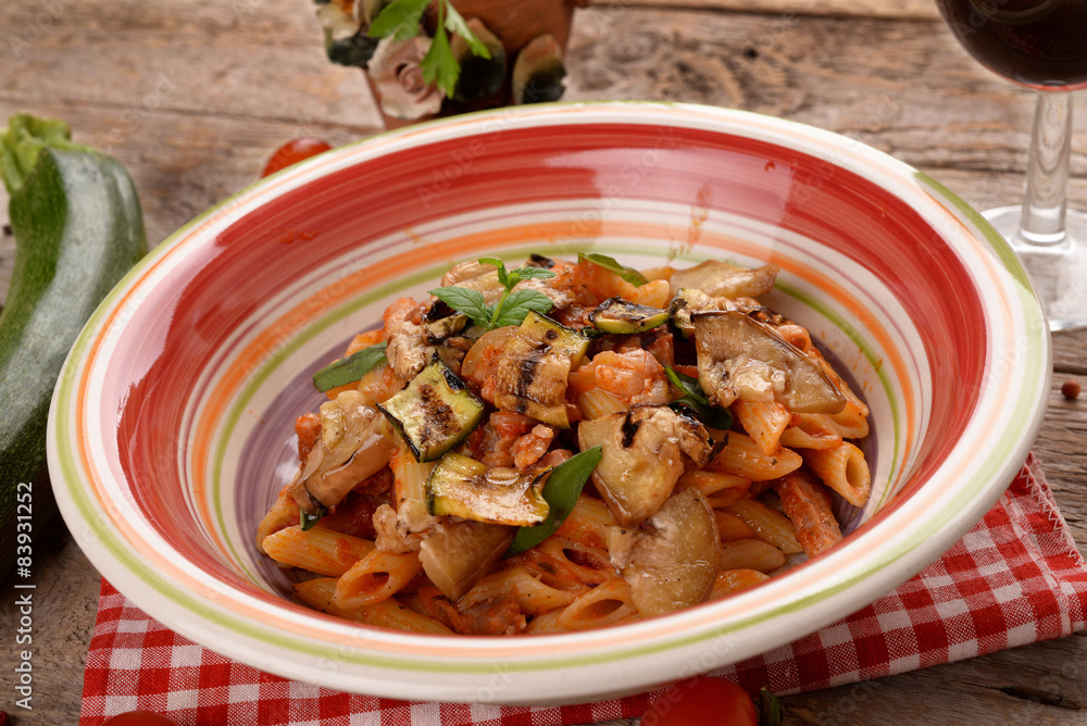 Penne with tomato sauce with bacon, zucchini and eggplants Penne with tomato sauce with bacon, zucchini and eggplants