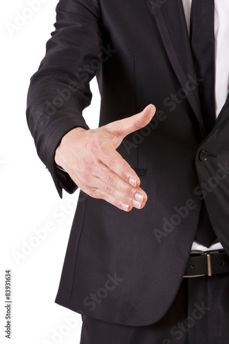 man with black suit shaking hands
