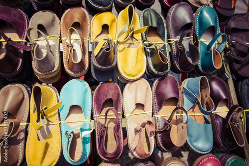 Leather shoes in different colors at a flea market