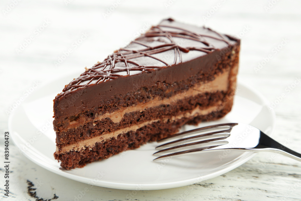 Dark chocolate cake on white wooden background Dark chocolate cake on white wooden background