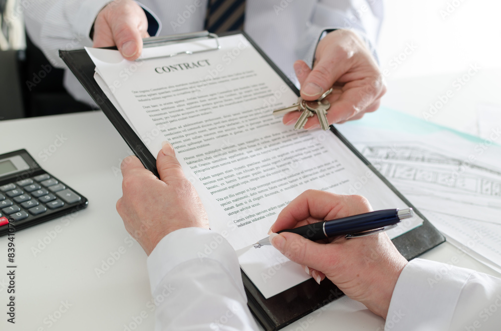 Client signing a real estate contract Client signing a real estate contract