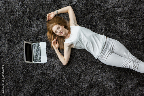 Woman laying on the carpet