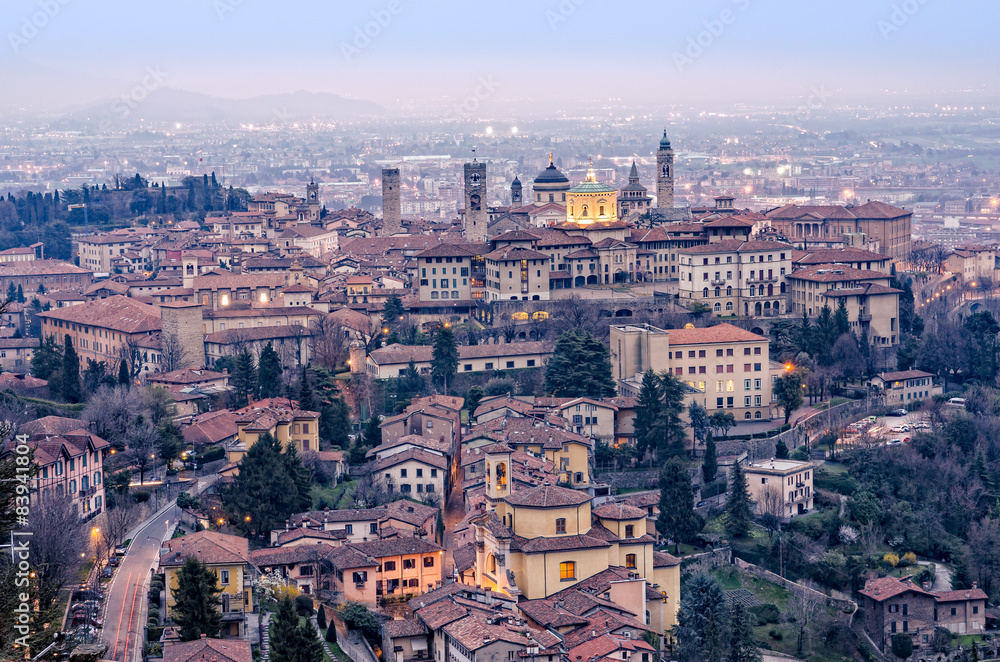 Scenic view of Bergamo old town cityscape fter sunset, Italy, Eu