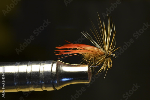 Bait fishing on mountain river. Imitation flies or moths photo