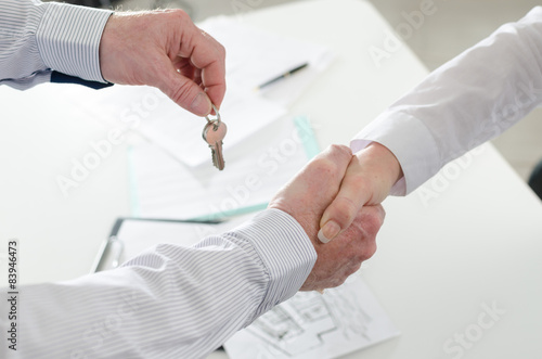 Realtor shaking hands with his client