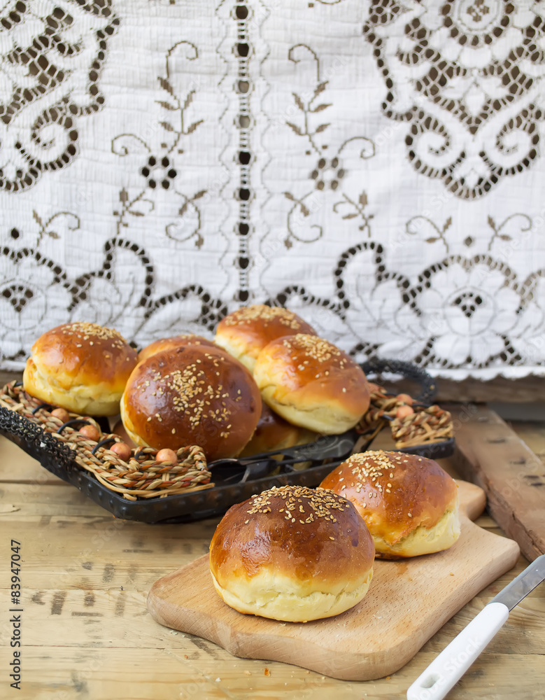 buns for burgers on wooden background