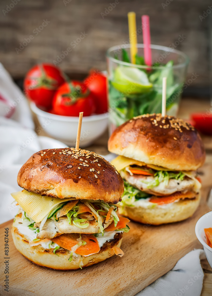 burgers with chicken and stuffed juicy with cucumber, carrots a burgers with chicken and stuffed juicy with cucumber, carrots a