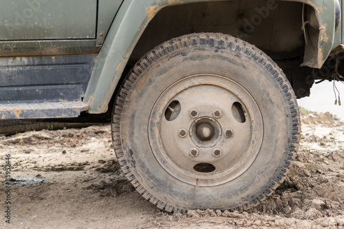 Muddy Dust Covered Vehicle Wheel