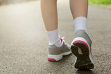 Young girl in running shoes. Healthy lifestyle concept. 